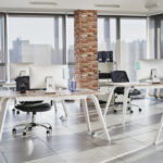 Person in protective workwear alone in an empty office